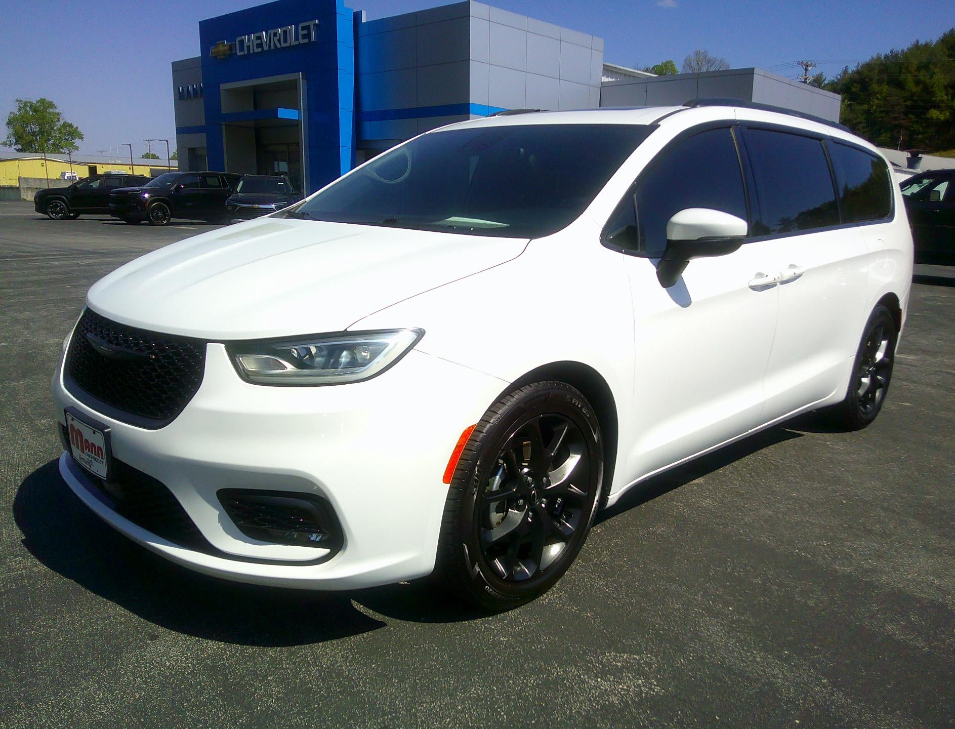2023 Chrysler Pacifica Touring L in White — front three-quarter view