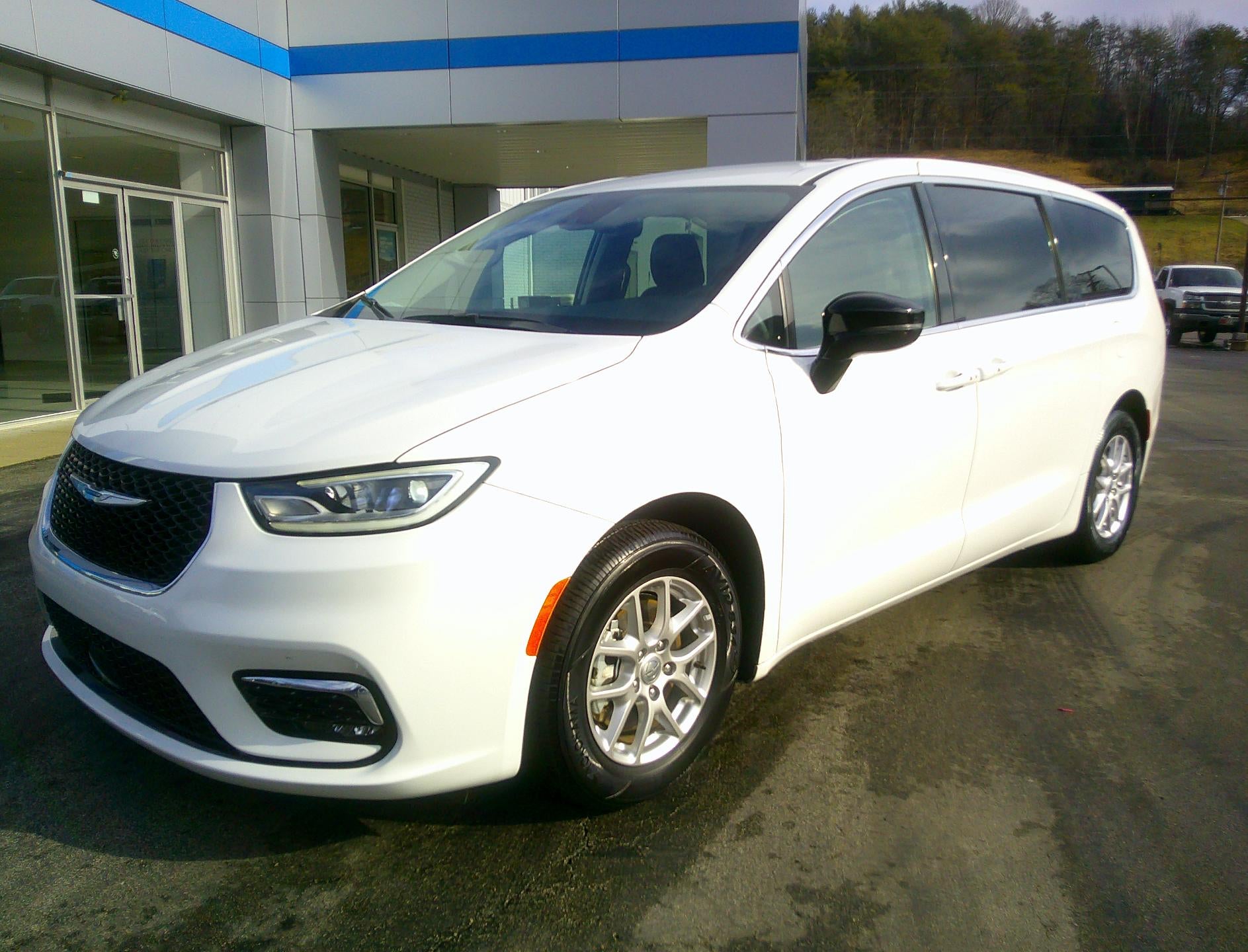 2024 Chrysler Pacifica Touring L in White — front three-quarter view
